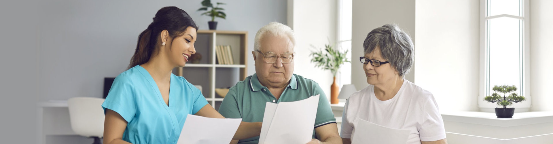 nurse reading result for the senior couple